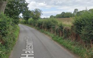 A man has died after a car crashed into a crop sprayer near Halesworth