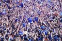 Hometown duo Luke Woolfenden and Cameron Humphreys are held aloft during Ipswich Town's promotion celebrations.