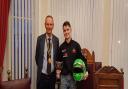 Euan Stephenson receives the Underwood Hardware Junior Sports Personality of the Year award from Felixstowe mayor Seamus Bennett