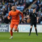 Kieffer Moore celebrates his opener in Ipswich Town's 2-1 win at Coventry City last night