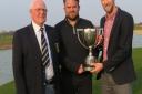 Aldeburghs James Ollington (centre) and Will Wright, the Suffolk Amateur Foursomes champions, after being presented with the McLeod Cup by Suffolk Golf Union president Bill Darling. Photograph: TONY GARNETT