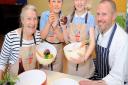 Earlier this year Orford Primary School celebrated Food Revolution Day with celebrity chef Gennaro Contaldo and original dinner lady from Jamies School Dinners, Nora Sands, with pupils  Harry Murphy, and Rachel Hall in the schools kitchen.