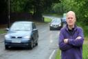 Tony Gearing is pictured outside his home in Stradishall where he is campaigning for a reduced speed limit.