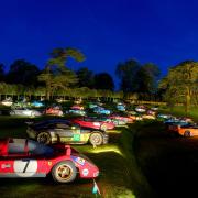 Classic vehicles illuminated in the Halls grounds