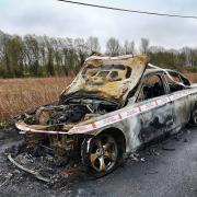 A stolen BMW has been found burnt out and discarded down a country lane.