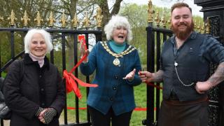 The mayor of Beccles, Christine Wheeler, cutting the ribbon to officially open the refurbished gates with new pillars. With her are Jennifer Langeskov, of the Beccles Townlands Charity, and Paul Stoddart.