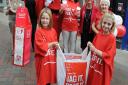 Seven year old Lucy Bluett visits the British Heart Foundation shop in Bury to raise awareness of the Bag It, Beat It campaign. Back, left to right, June Winters, Sarah Faiers, Amanda Prentice (Lucy's mum), Jan Matthews, Lou Hovell with Lucy (left) and he