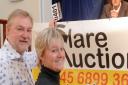 Cllr Alaric Pugh with Vanessa Howard, trustee of the Combined Halls of Clare, with auctioneer Robin Stone at a recent auction at Clare Town Hall.
