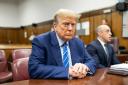 Former US president Donald Trump awaits the start of proceedings on the second day of jury selection at Manhattan Criminal Court in New York (Justin Lane/Pool Photo via AP)