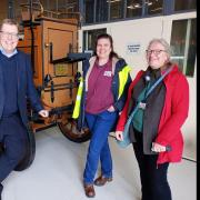 Mark Smith from Ipswich Transport Museum receives the pump from Lisa Harris (Food Museum) and Anna Mercer (Colchester and Ipswich  Museums).