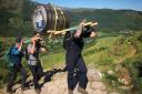 A whisky barrel was carried to the top of the UK's highest peak by an RAF team to fundraise for charity.