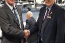 Suffolk Coastal leader Ray Herring and Waveney leader Colin Law shake hands after both district councils agreed to merge to form the largest district in the country. PHOTO: Contributed