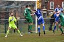 Peter Lambert heads in his 96th goal for Gorleston to put his side three up at Wroxham Picture: DAVID HARDY