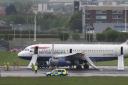 A British Airways plane surrounded by emergency vehicles after it had to make an emergency landing at Heathrow airport. PRESS ASSOCIATION Photo. Picture date: Friday May 24, 2013. Both runways at Heathrow airport were closed after a British Airways plane 