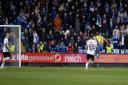 Shaun Whalley scores the equaliser against 10-man Ipswich Town at Shrewsbury yesterday