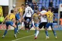 Conor Chaplin is denied by the keeper from point blank range early on at Shrewsbury.