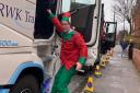 Dennis Anderson in his elf costume as lorry drivers delivered toys to charities in Felixstowe and Ipswich