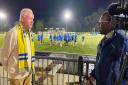 Andrew Long is pictured being interviewed by ITV Anglia Sports Correspondent Donovan Blake at Tuesday night’s training session at AFC Sudbury.