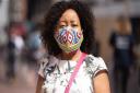 Kele in her brightly coloured face mask ready to shop in Ipswich  - health chiefs still expect people to wear them in enclosed spaces even after restrictions are lifted
