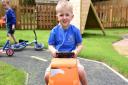 Cian at Claydon Pre-school, which now has a new play area.