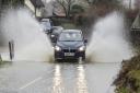 A Suffolk County Council meeting has heard that the backlog of road flooding problems could take 10 years to fix