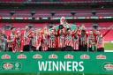 Sunderland players celebrate with the Papa John's Trophy after the 2021 final at Wembley Stadium on Sunday.