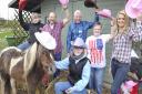 Jimmy's Farm's Andrew Barfield and Shetland Pony Bella along with St Elizabeth Hospice's volunteer Keith Digweed and  Norman Finbow, Jimmy's Farm's Shannon Cullum, volunteer Christine Heffer and the hospice's event fundraiser Leanne Carhart to launch the 