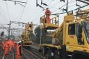 Network Rail engineers repairing the damaged wires between Colchester and Marks Tey. Picture; NETWORK RAIL/GREATER ANGLIA