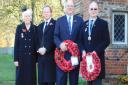 Taking the salute at Melford Hall gates, left to right: Audrey Wreford, chairman of Long Melford RBL, Sir Tim Bridge Deputy Lord Lieutenant of Suffolk, William Hyde Parker, of Melford Hall, and councillor John Nunn president of Long Melford RBL Picture: