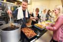 Gatehouse Christmas day meal at St Benedict's Catholic School in Bury. Serving is Jim Herrington.