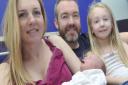 Leanne Peart holds Maja Symonds, who was born on New Year's Day in Ipswich Hospital, with her partner Stefan Symonds and daughter Darcey Symonds, 6.