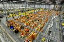 Amazon associates picking and packing customer orders at the Amazon fulfilment centre at Hemel Hempstead, Hertfordshire. Photo:  Nick Ansell/PA Wire