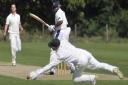 Frinton Cricket Club's Mervyn Westfield hits the ball at Woolpit Cricket Club.