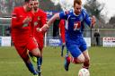 Leiston's Patrick Brothers attempts to get away from the challenge of Harrow's Josh Webb