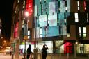 Poppy's are projected on to the front of the UCS building in Ipswich on Armistice Day. Photograph Simon Parker