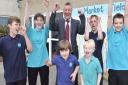 Market Field School headteacher Gary Smith is celebrating with pupils Bradley Coyle, Herry Mayhead, Harvey Skiffington, Vinnie Cook, Charlie Lattimer and Luke Tucker now that long awaited plans to demolish the school and rebuild it is set to be approved a