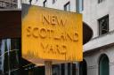 The sign outside New Scotland Yard in London after it was spray painted by a Just Stop Oil protester