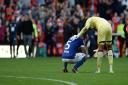 Ipswich Town's Sam Morsy is comforted by Charlton 'keeper Joe Wollacott at the final whistle at the Valley.