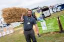 Patrick Wrenn from Suffolk New College helping to set up its stand at the Suffolk Show.