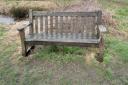 The bench set up as a memorial to Alastair Douglas, which was thrown into a pond, but has since been restored to its previous position
