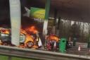 Two people are in hospital after a petrol station fire