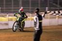 Ipswich Witches skipper Danny King takes the flag to win heat three