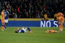Omari Hutchinson and Matty Jacobs slump to the turf following the breathless 3-3 draw between Hull City and Ipswich Town.