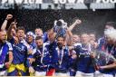 Ipswich Town players celebrate promotion this afternoon