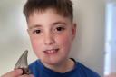 Kenzie Bryenton with the shark tooth he found on an Essex beach