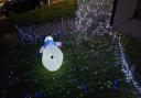 The snowman lies face down in the front garden of Mr Cockroft's home after vandals targeted the display