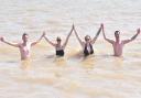 Callum Gale, Tasmin Humphrey, Tilly Davies, Miles Fowler enjoy the sunshine and a dip at Southwold beach.