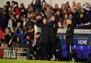 Ipswich Town manager Kieran McKenna punches the air in celebration at the final whistle.