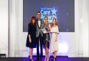 Geoff Edwards and Elena Bratu of Care UK receiving Davers Court's Care Home of the Year award at the National Care Awards