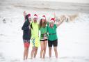 Despite the official St Elizabeth Hospice Christmas Day swim being cancelled many people braved the elements to take the plunge